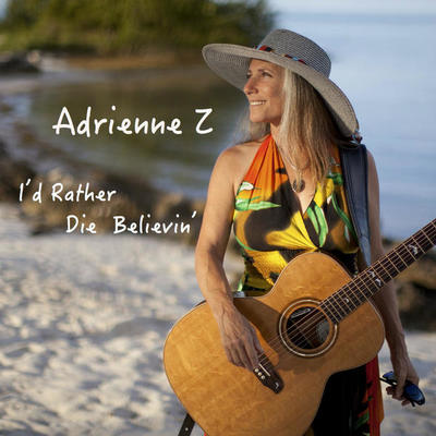 Adrienne Z on beach with guitar